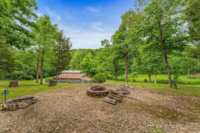 228 Cabin Ln, Kissee Mills, MO 65680 - view of patio with a fire pit and a forest view