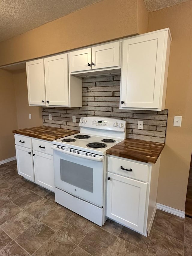 kitchen featuring white electric stove, baseboards, wood counters, a textured ceiling, and white cabinetry