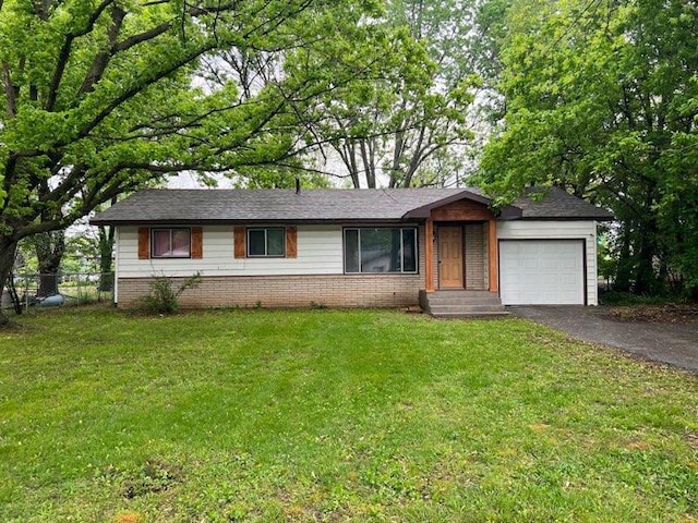 single story home featuring an attached garage, a front lawn, driveway, and fence