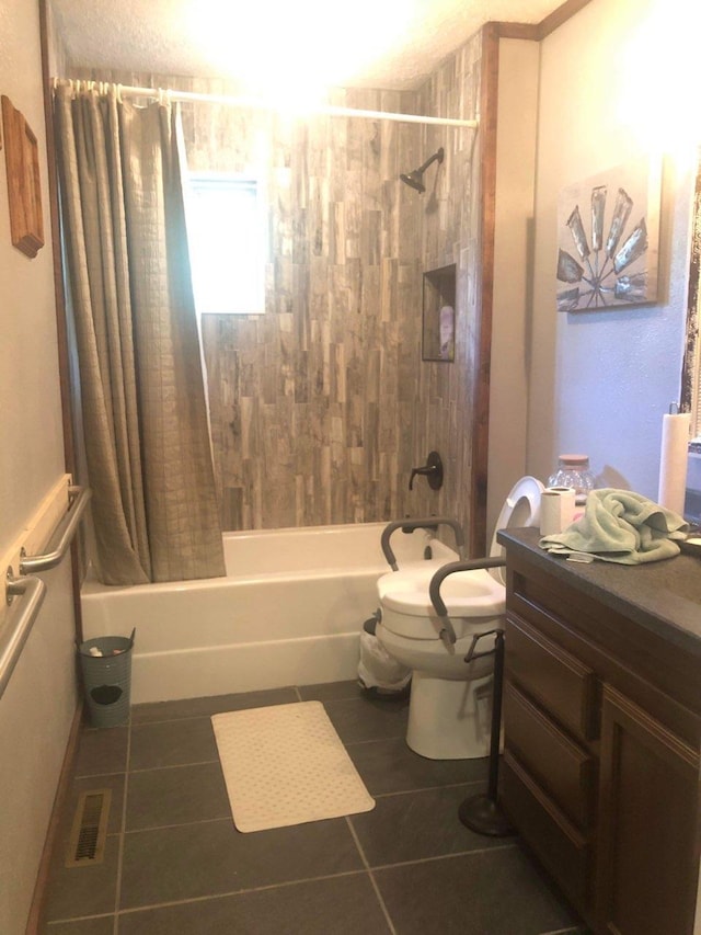 full bathroom with shower / bath combination with curtain, vanity, tile patterned flooring, and toilet