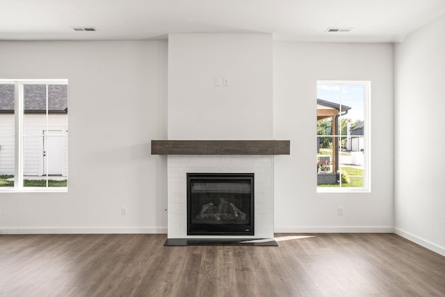 unfurnished living room with hardwood / wood-style floors