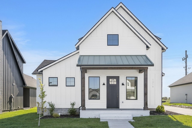 modern farmhouse with a front lawn