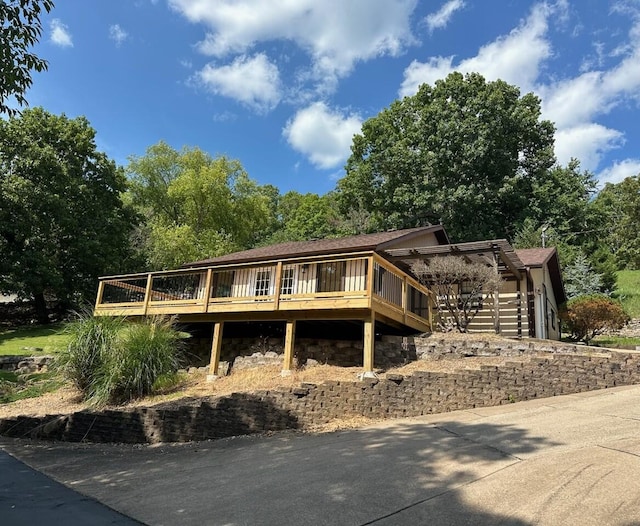 rear view of property with a deck