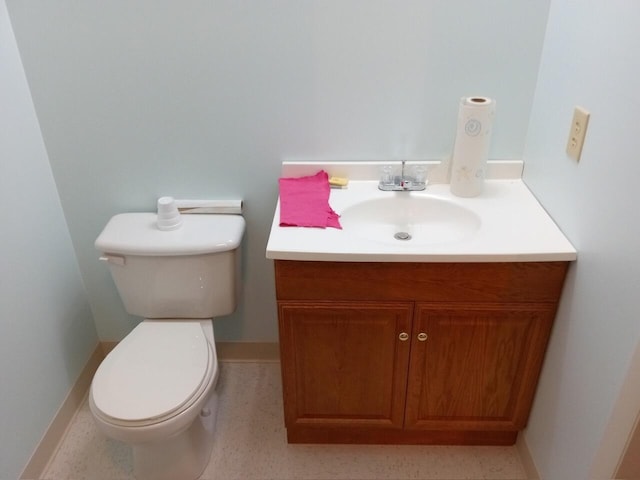 bathroom with toilet and vanity