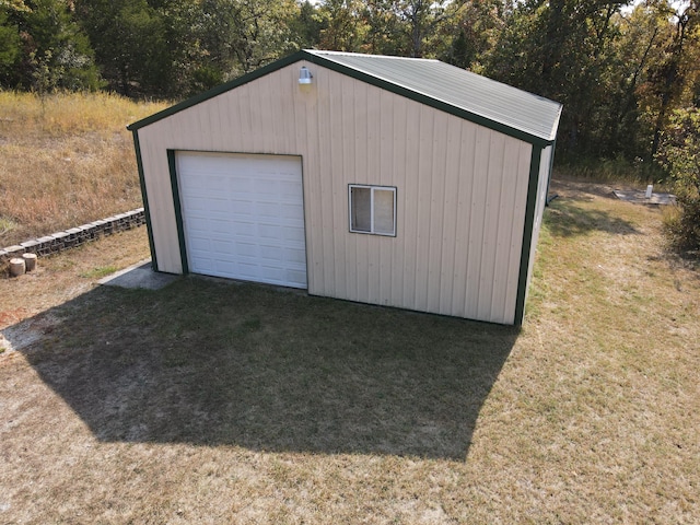 garage with a yard