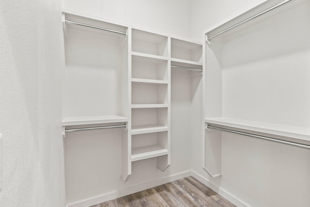 walk in closet featuring light hardwood / wood-style flooring