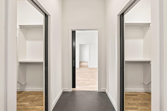 hallway with wood-type flooring