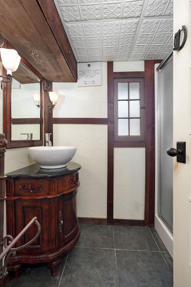 bathroom featuring vanity, tile patterned floors, and an enclosed shower