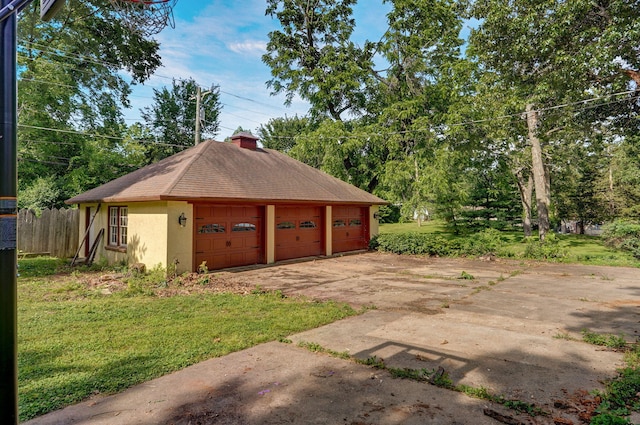 garage with a lawn