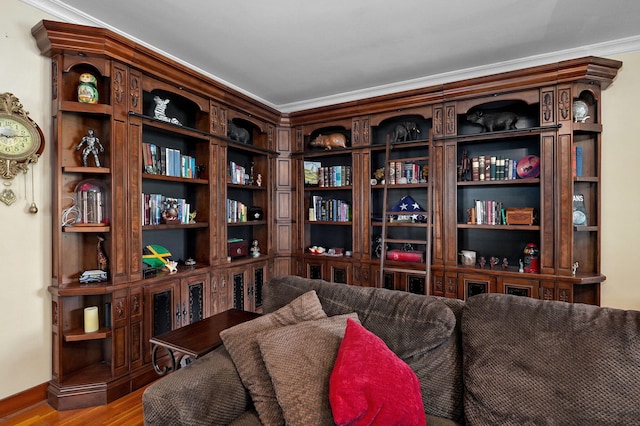 sitting room featuring light hardwood / wood-style floors and crown molding