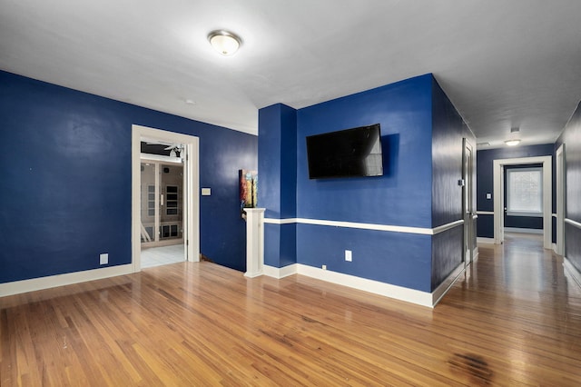 unfurnished room featuring hardwood / wood-style floors