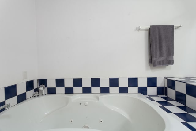 full bathroom featuring a whirlpool tub