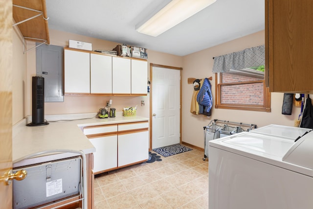 laundry room with washer and dryer, cabinet space, and electric panel