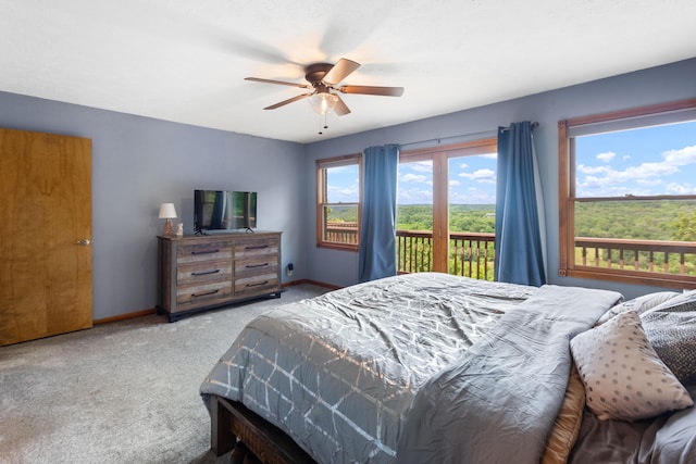 bedroom featuring carpet floors, baseboards, access to outside, and a ceiling fan