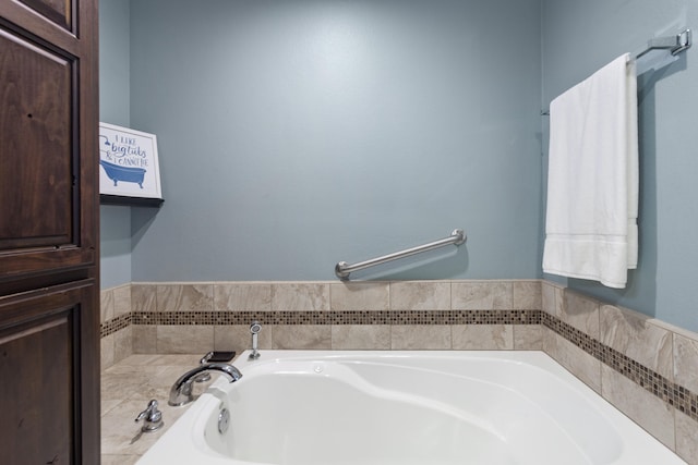 bathroom with a tub to relax in