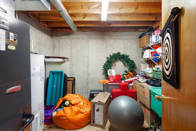 interior space featuring heating unit and water heater