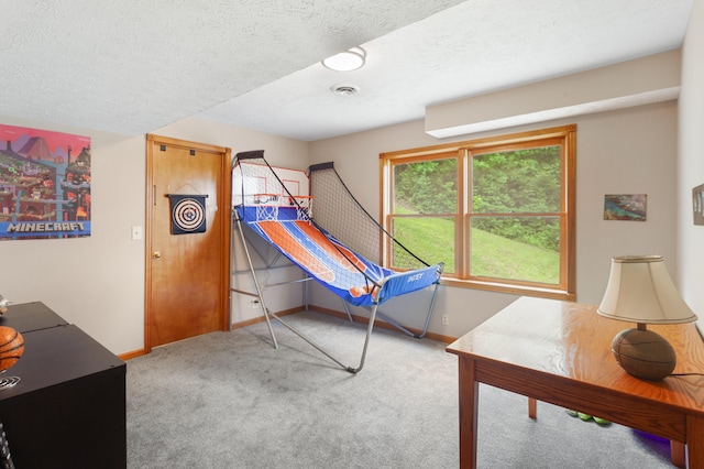 carpeted bedroom featuring a textured ceiling