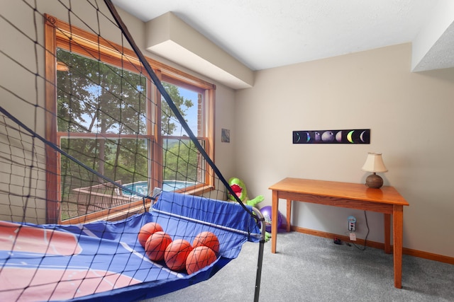 bedroom featuring carpet floors and baseboards