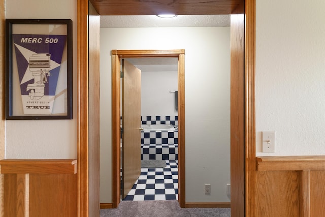 hall featuring baseboards