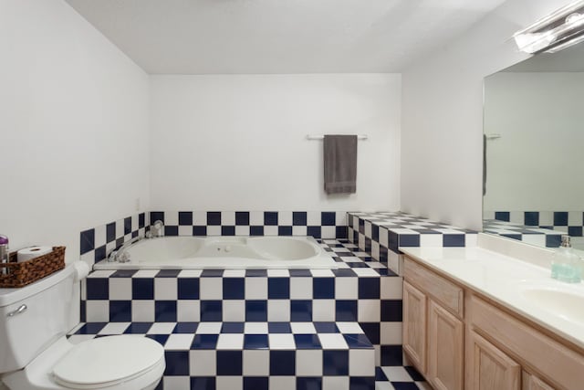 full bathroom featuring a bath, tile patterned floors, vanity, and toilet
