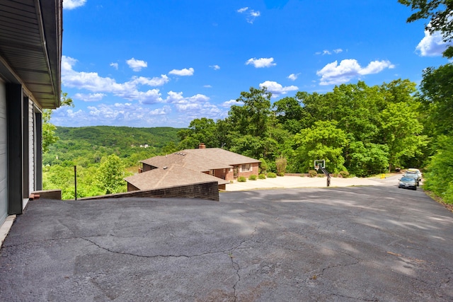 view of patio / terrace with a forest view