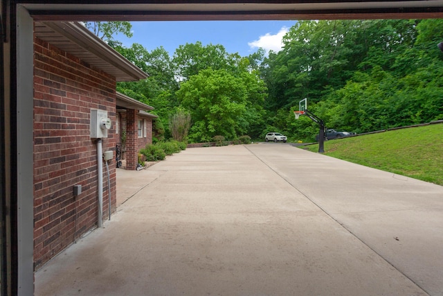 view of patio featuring concrete driveway