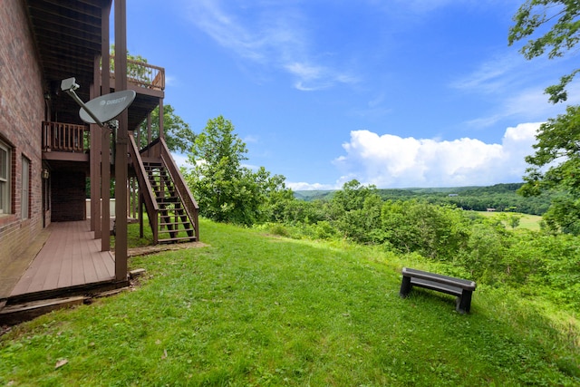 view of yard with a wooden deck