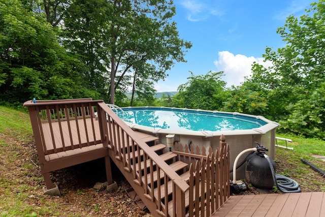 view of pool featuring stairway and a wooden deck