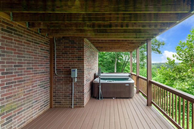 deck featuring a hot tub