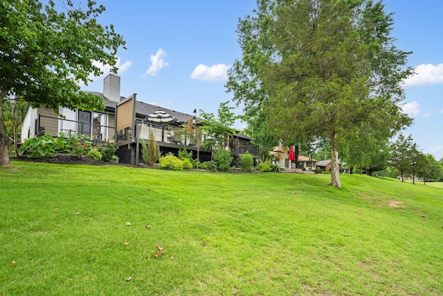 view of yard with a deck