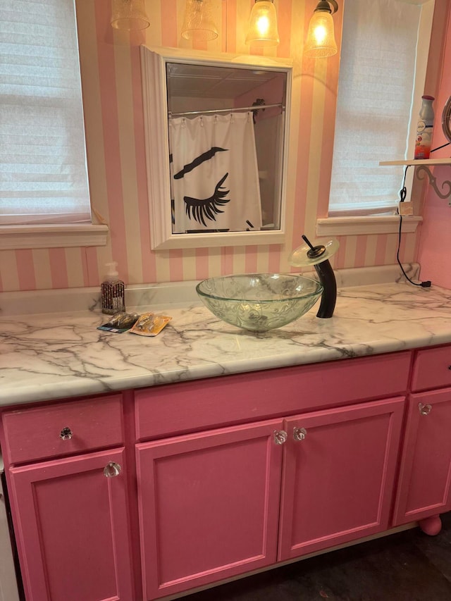 bathroom featuring vanity, a wealth of natural light, and a shower with shower curtain