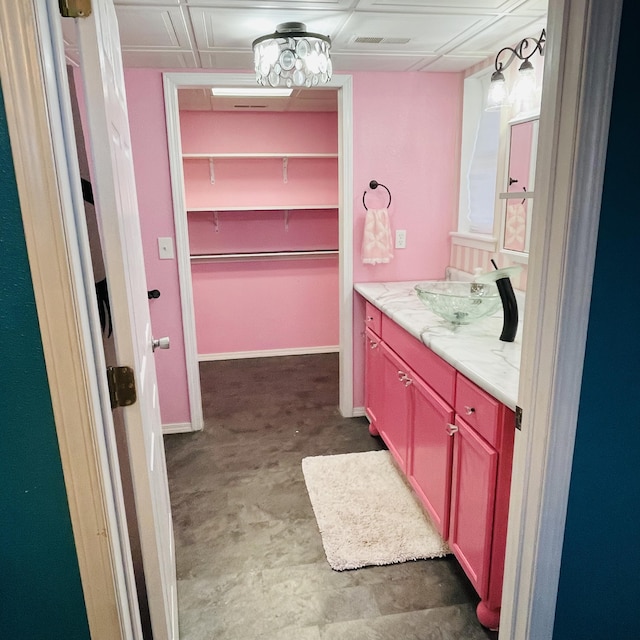 bathroom featuring vanity and concrete flooring