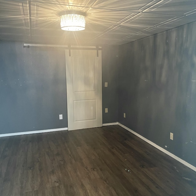 unfurnished room featuring dark wood-type flooring