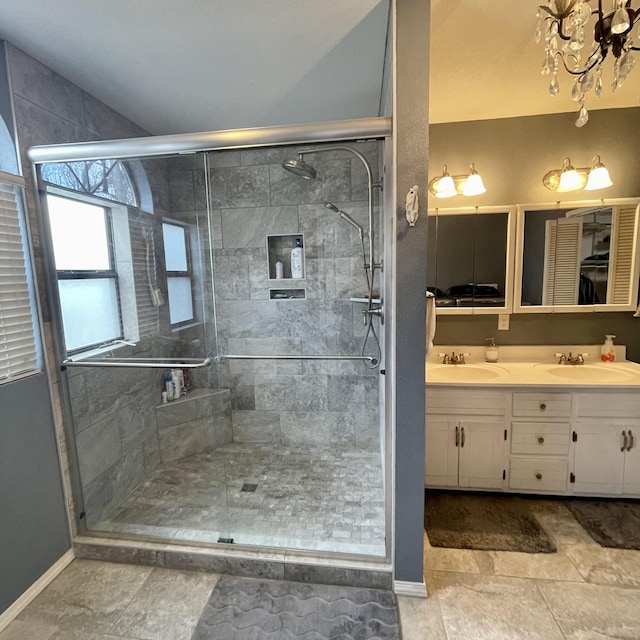 bathroom featuring vanity and an enclosed shower