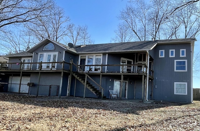 back of property featuring a deck