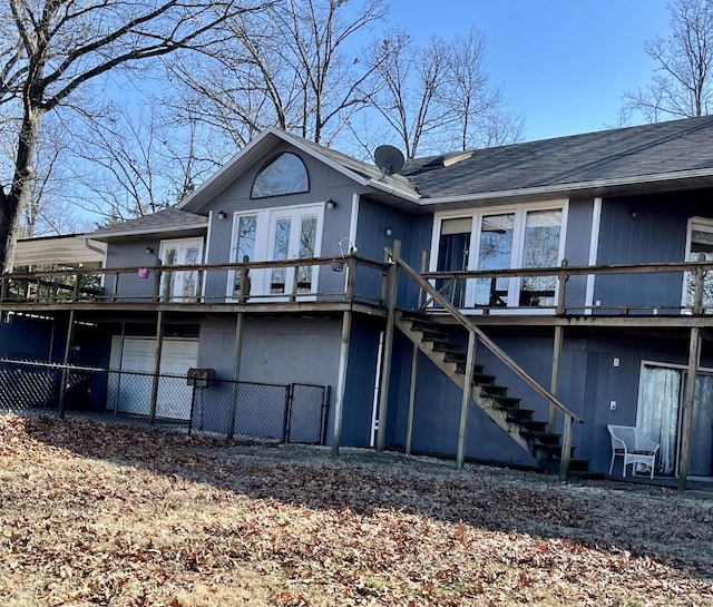 back of property with a wooden deck