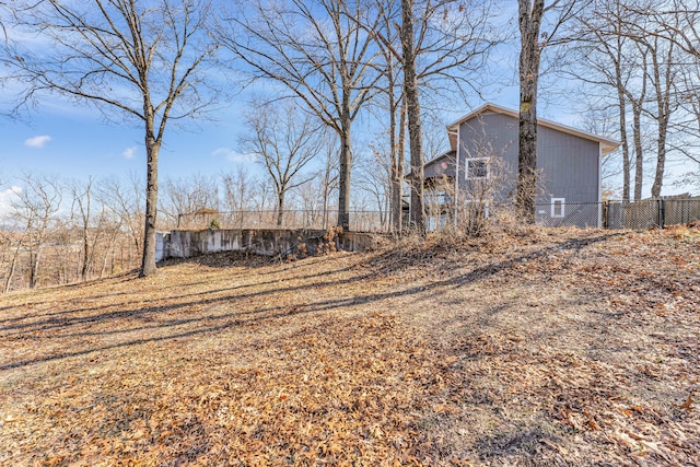 exterior space featuring crawl space and fence