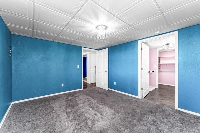 unfurnished bedroom with carpet flooring and baseboards