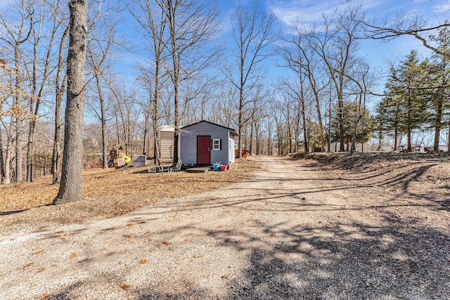 exterior space with an outbuilding and a shed