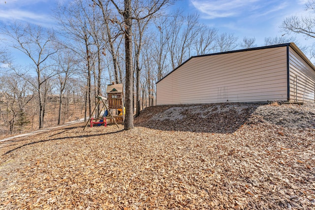 view of property exterior featuring a playground