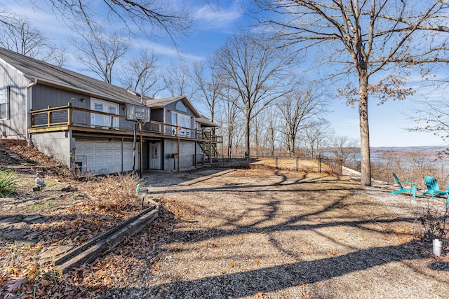 exterior space with a garage and a deck