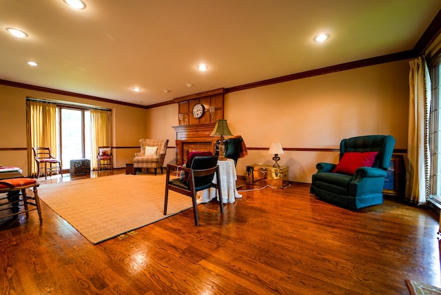 interior space featuring ornamental molding, a brick fireplace, and dark wood-type flooring