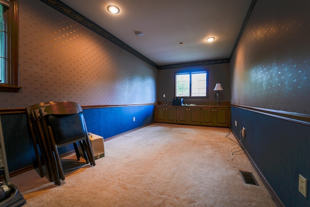 unfurnished room with light carpet and crown molding