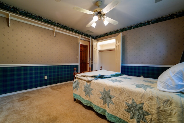 bedroom with light colored carpet and ceiling fan