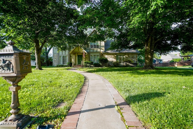 view of front of house featuring a front yard and fence