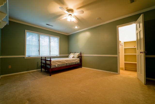 unfurnished bedroom featuring ceiling fan, light carpet, and ornamental molding