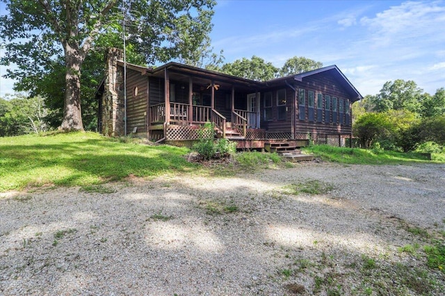 view of front of property with a wooden deck