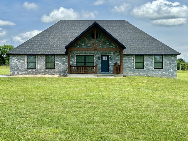 view of front of house with a front lawn and covered porch