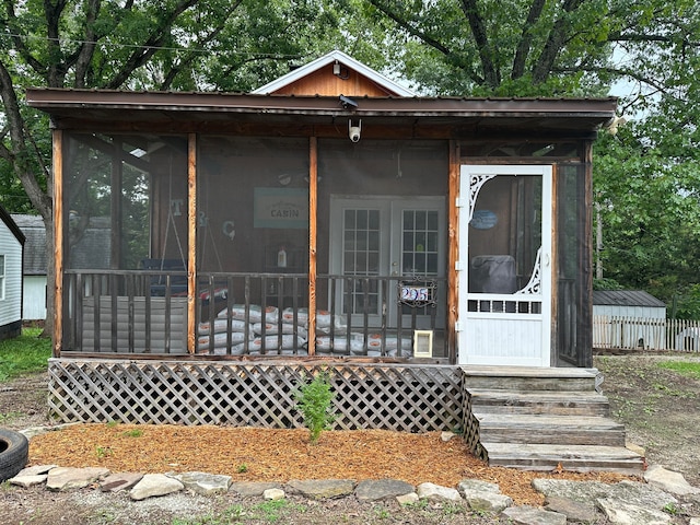 view of front of home featuring a sunroom