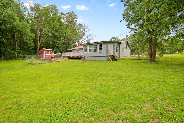 view of yard featuring a wooden deck